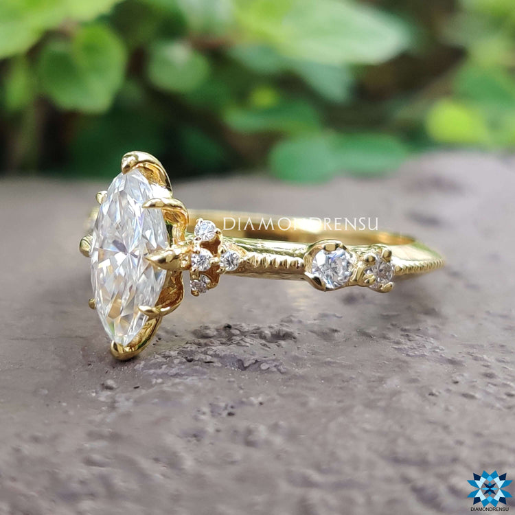 Vintage style engagement ring with marquise and round stones.