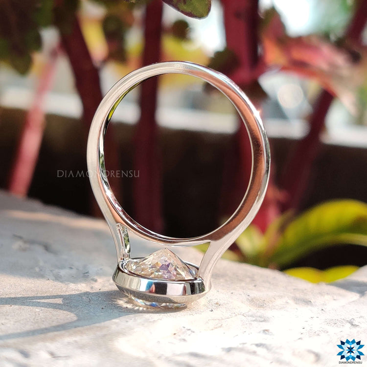 Diamondrensu UK Portuguese cut moissanite engagement ring.