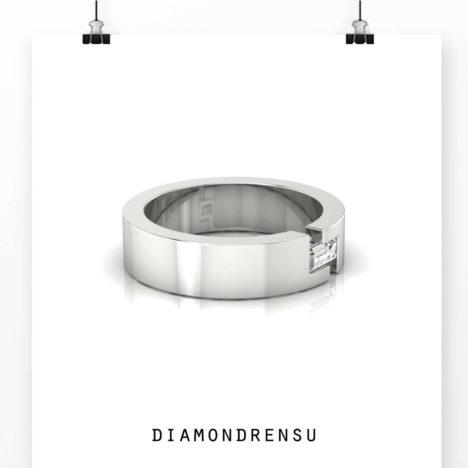 White gold minimalist diamond wedding ring with baguette cut diamond.