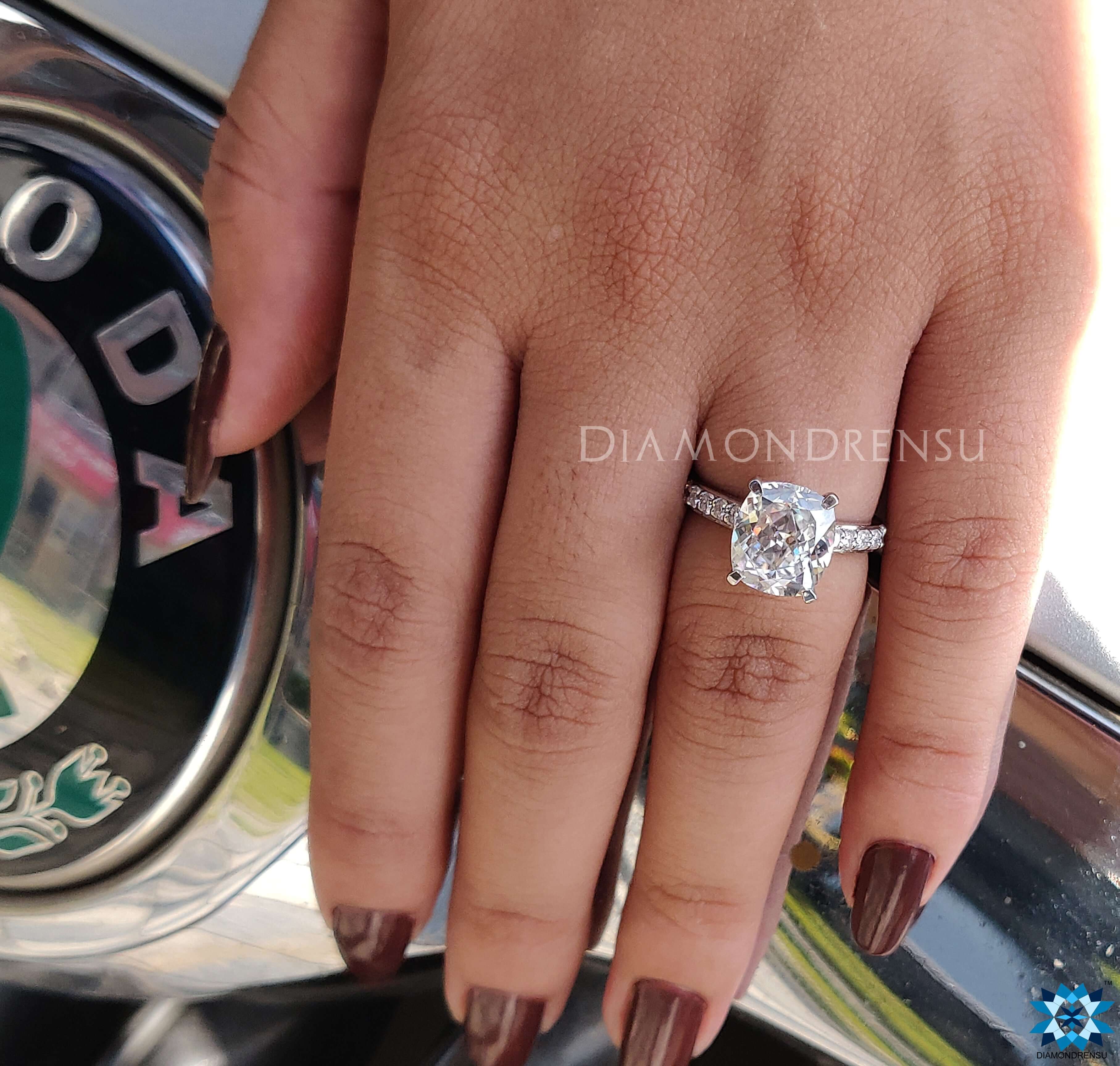 Cathedral setting ring with a cushion cut diamond for elegant detail.