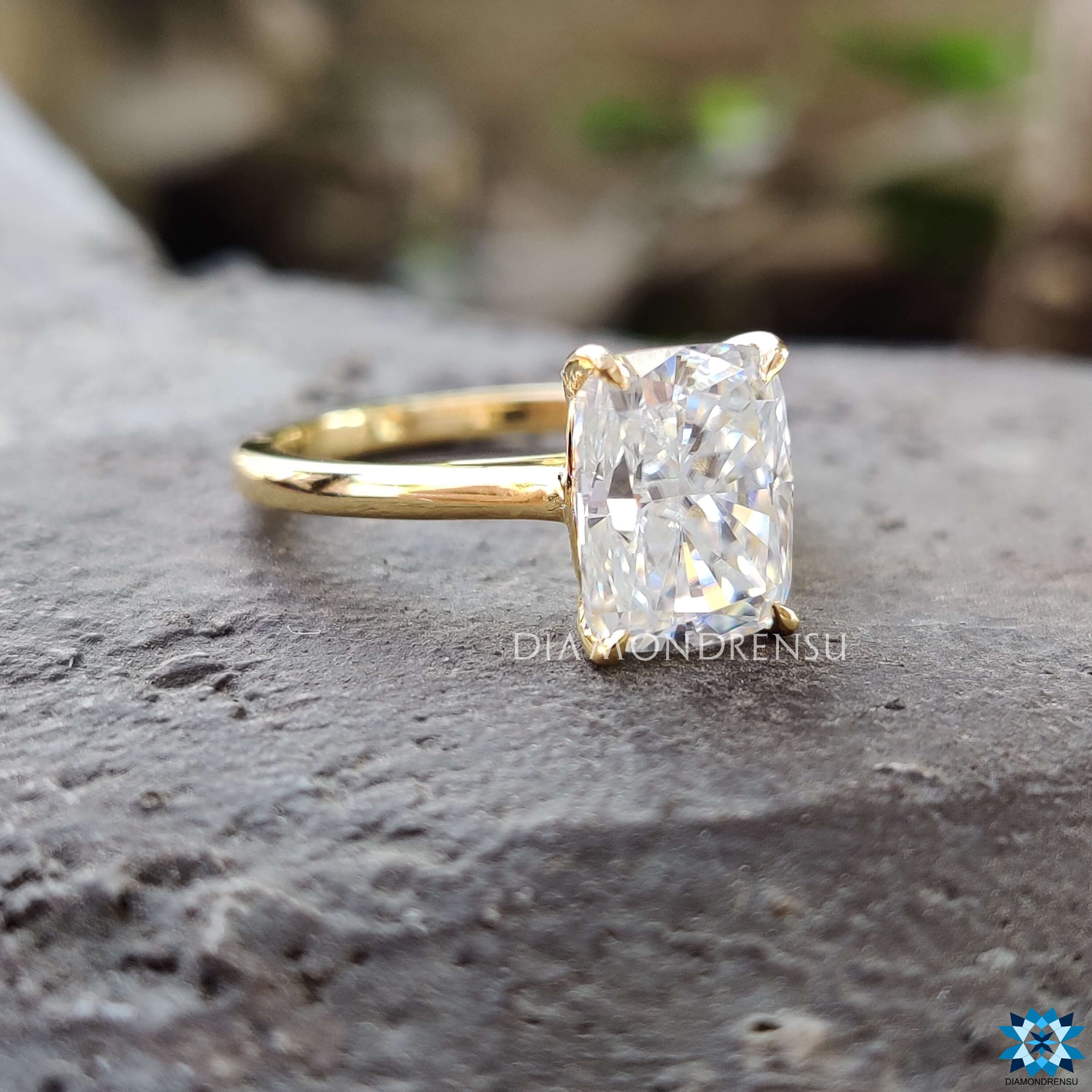 Custom solitaire moissanite ring crafted in yellow gold.
