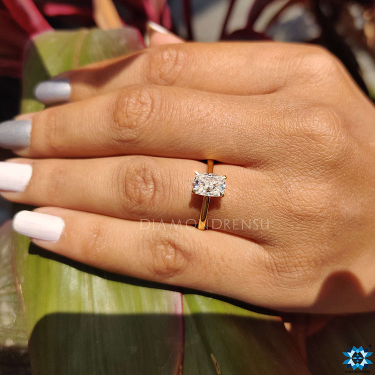Unique moissanite ring designed in a minimal 4 prong solitaire setting.