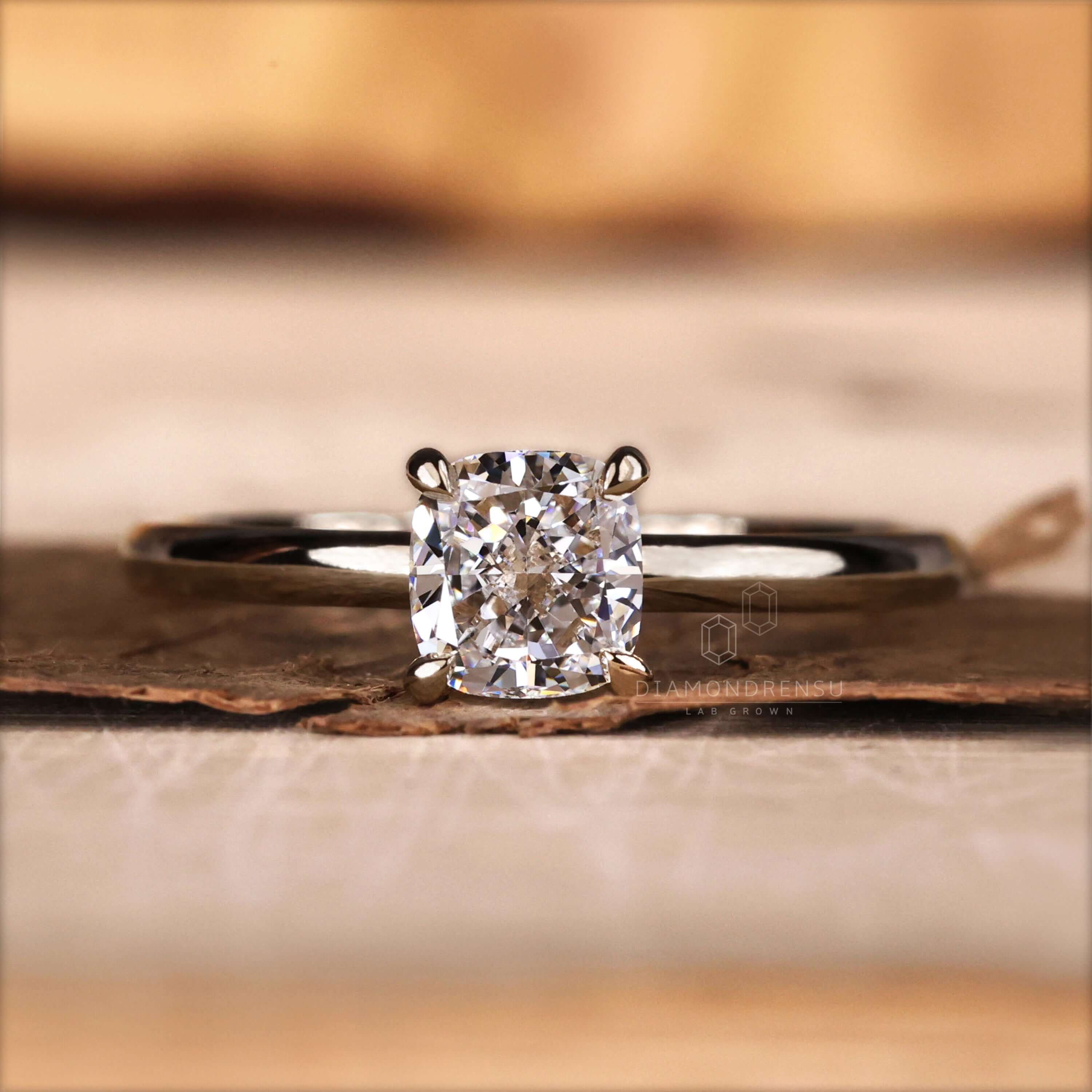 Cushion cut engagement ring in a 4 prong claw setting, ideal for proposals or as a UK engagement ring.