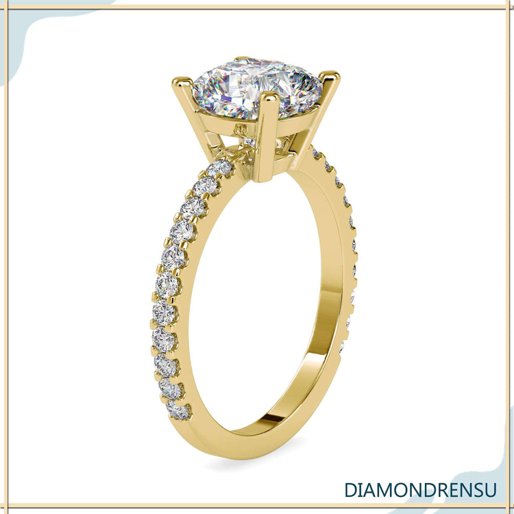 Basket setting ring with cushion and round cut diamonds.