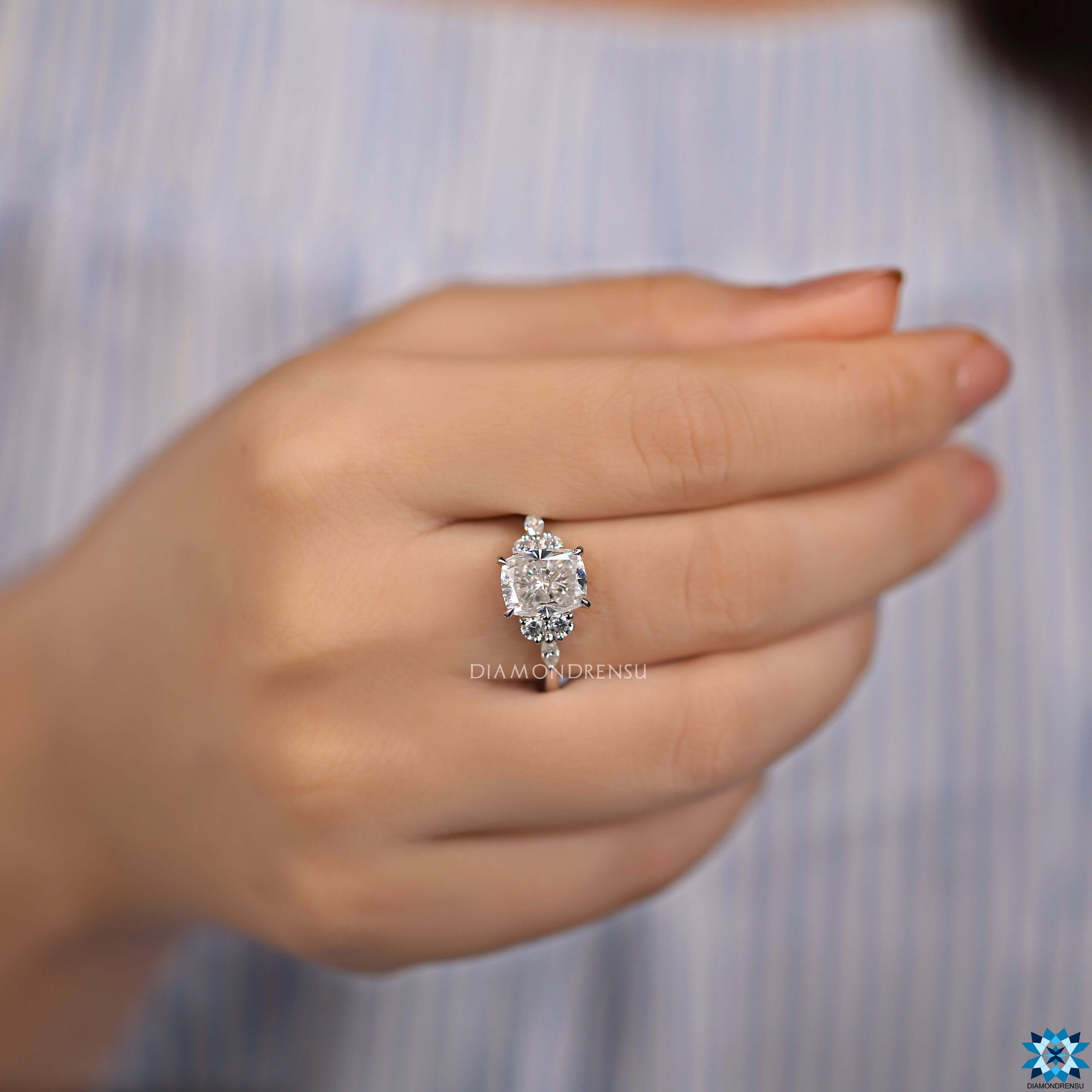 Prong set cushion engagement ring with handcrafted details.