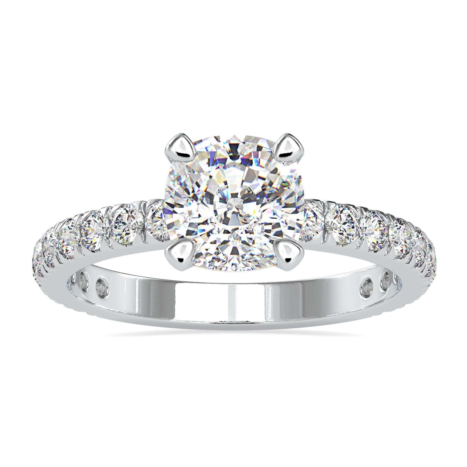 Cushion cut diamond ring with prong setting in white gold.