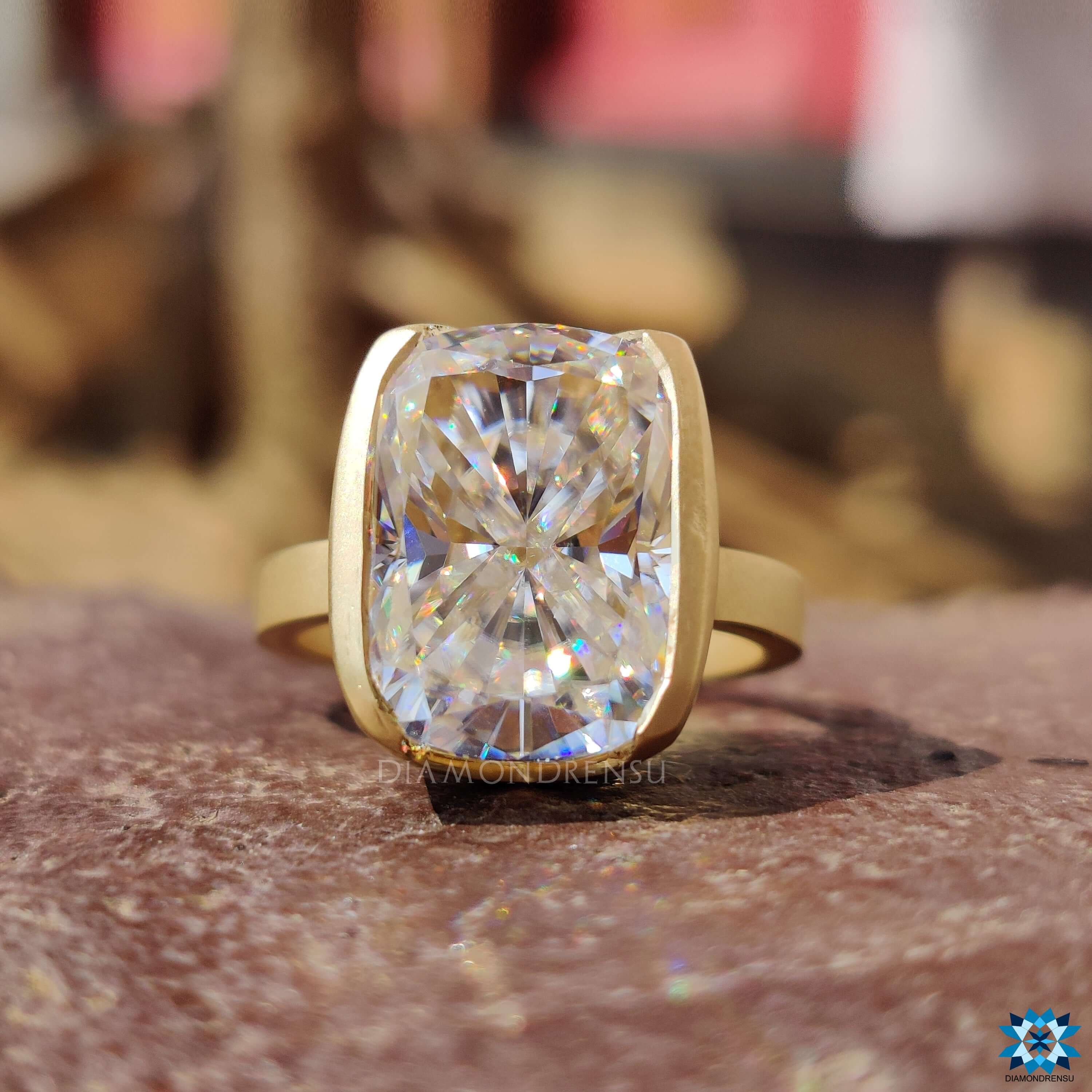 Custom engagement ring with half bezel and solitaire setting.