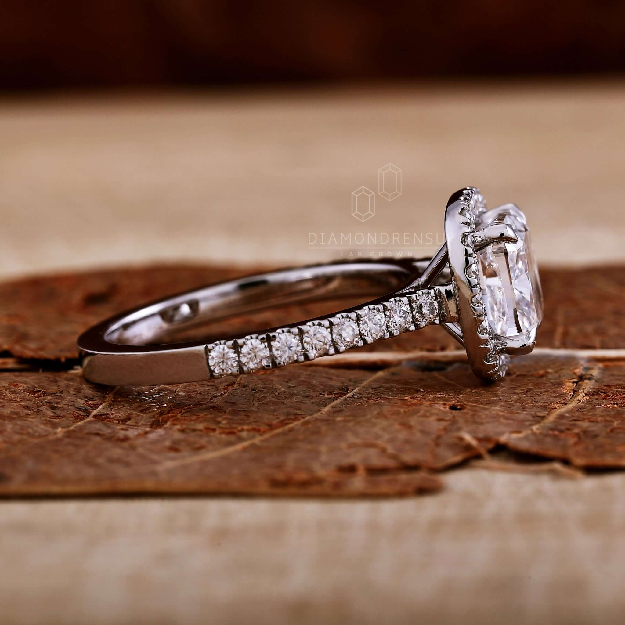 Halo ring with a stunning cushion cut ring diamond for timeless beauty.