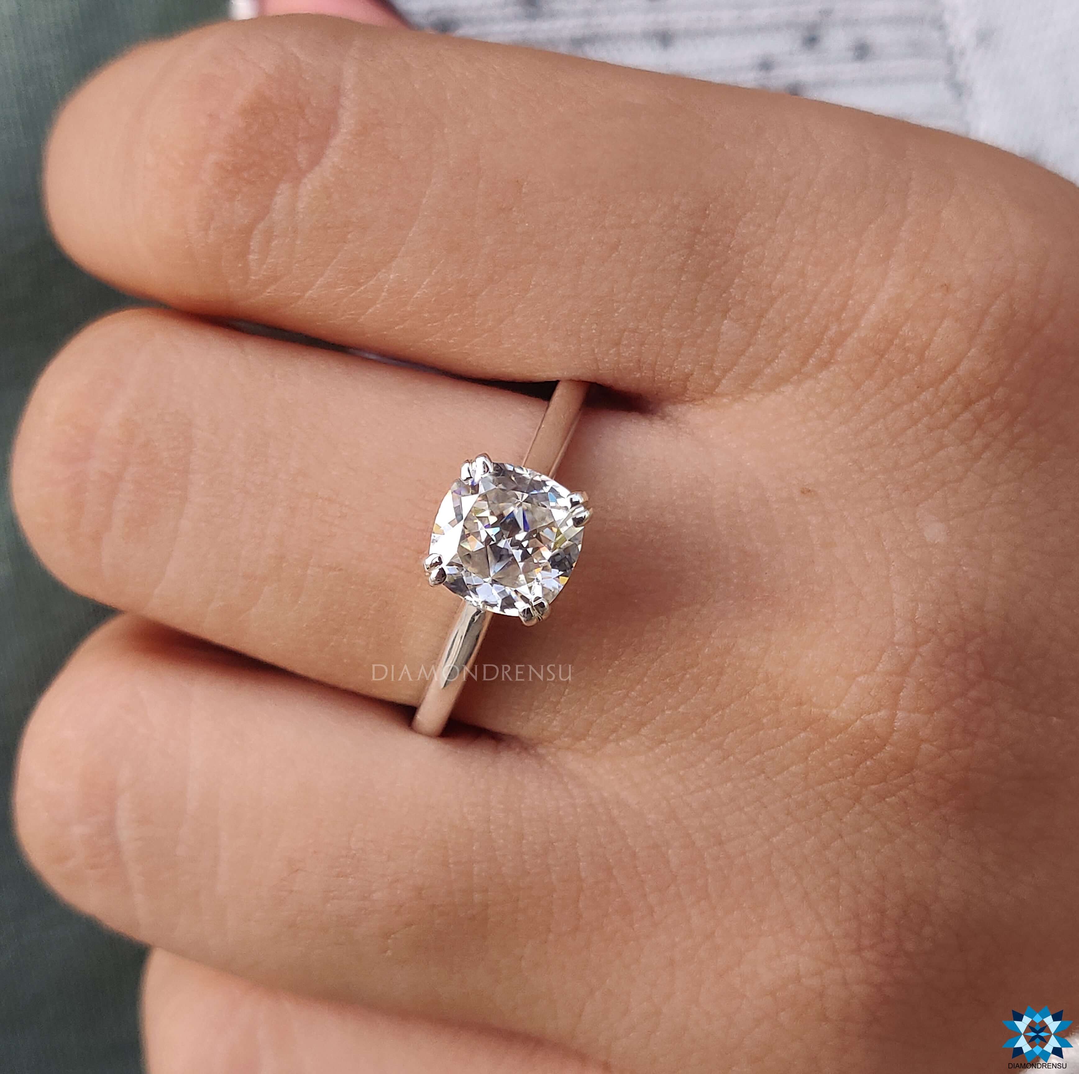 Cushion cut engagement ring in white gold with custom design