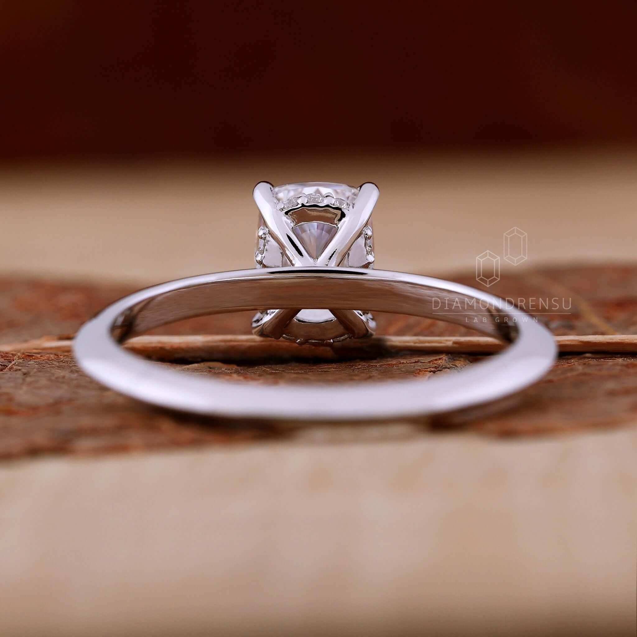 Handmade jewelry featuring a diamondrensu UK ring with a hidden halo design.