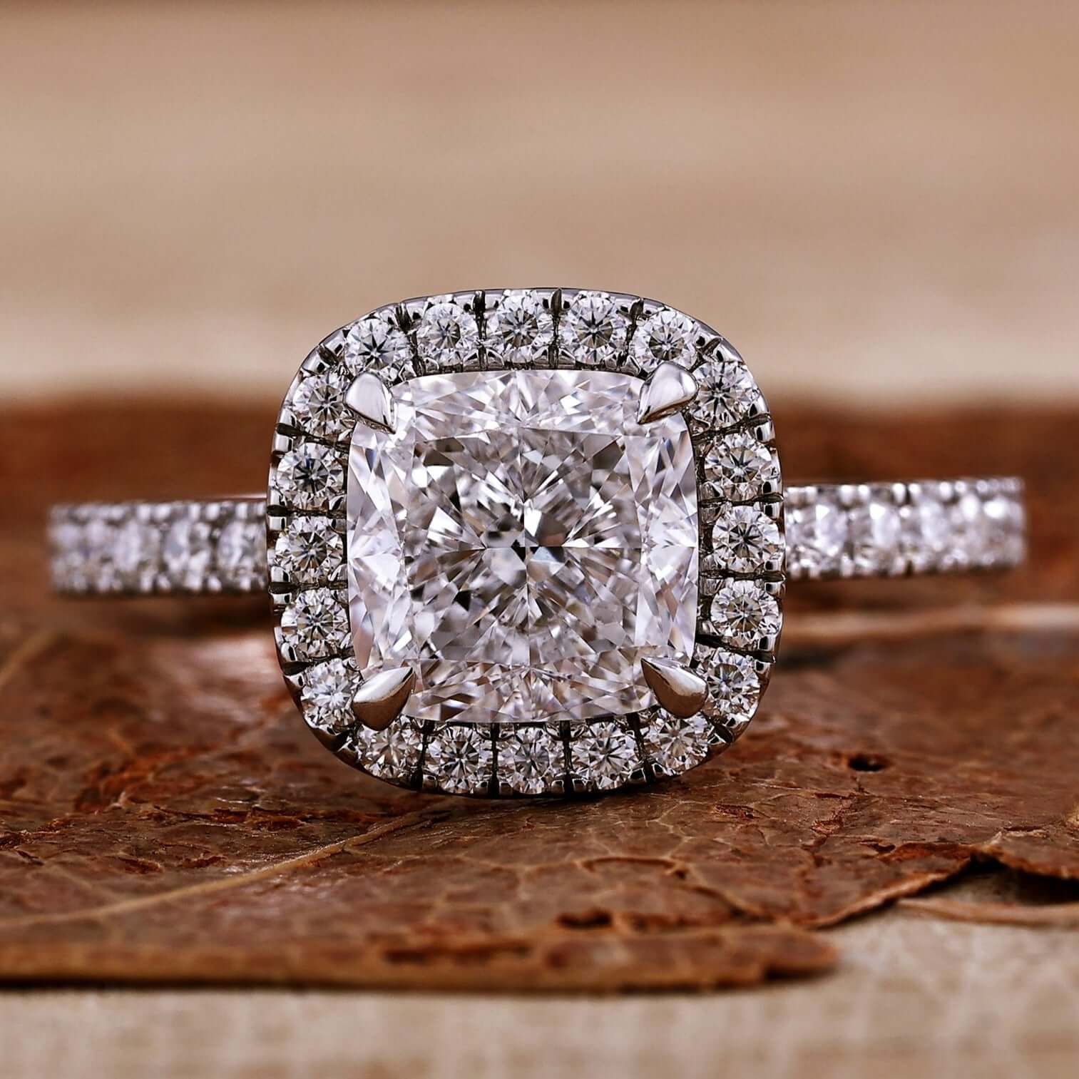 Cushion cut diamond ring with a classic cathedral setting design.