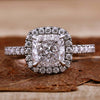Cushion cut diamond ring with a classic cathedral setting design.