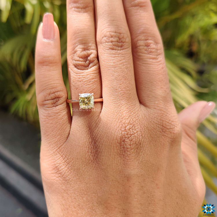 Canary yellow moissanite set in a solitaire design.
