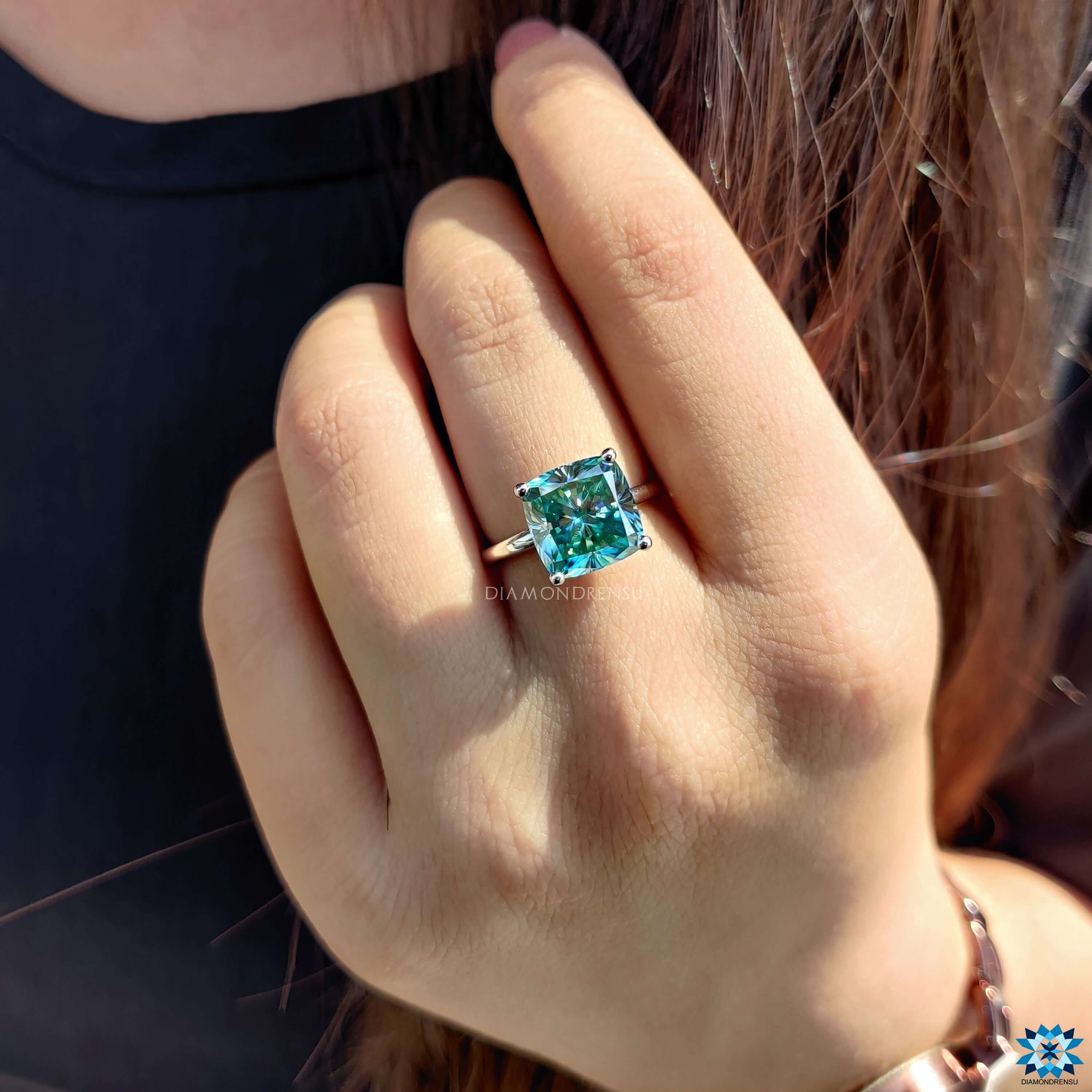 Buy moissanite ring with vibrant cyan blue stone.