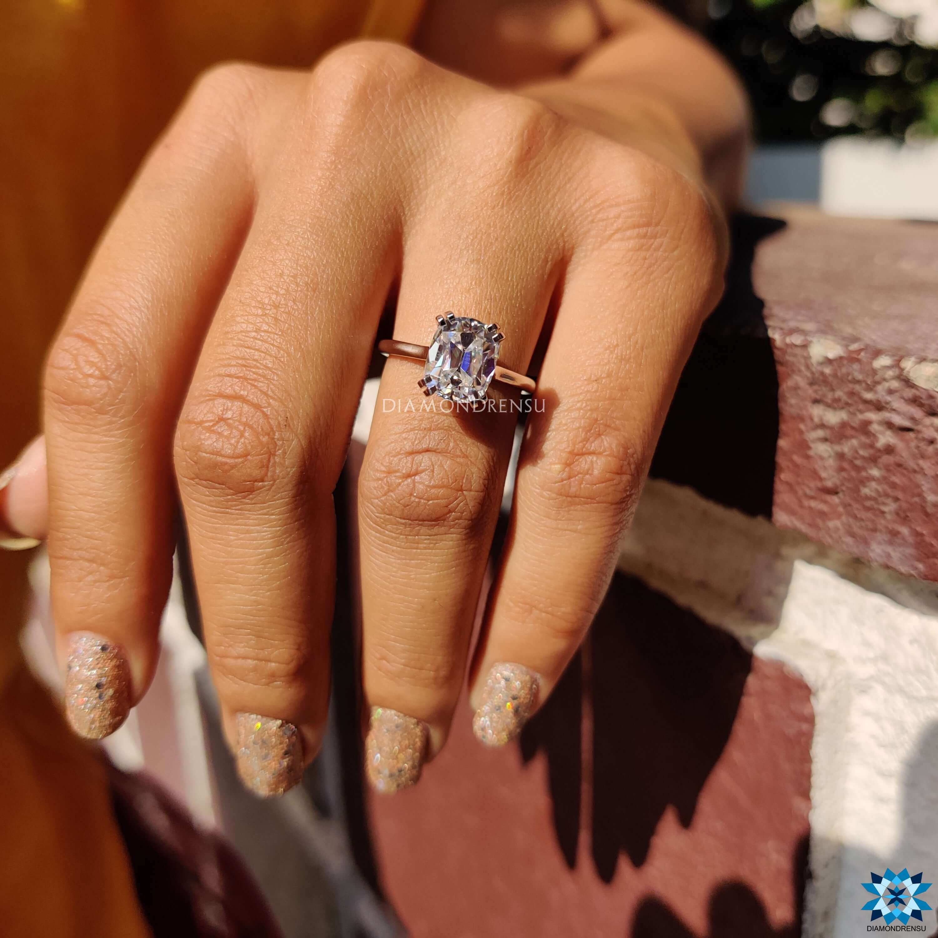 Handmade jewelry with elongated cushion moissanite center.