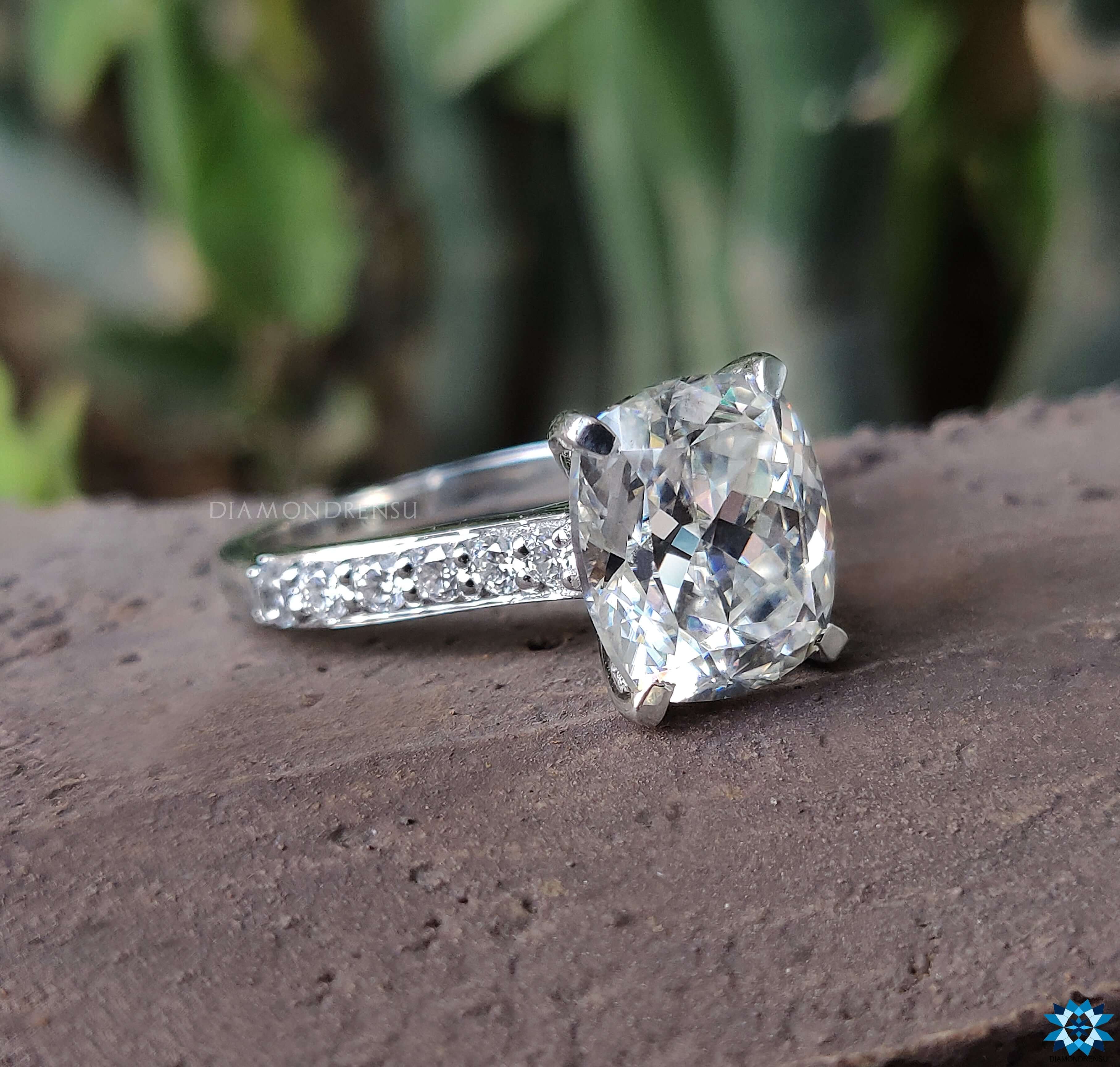 White gold engagement ring featuring a cushion cut for timeless beauty.