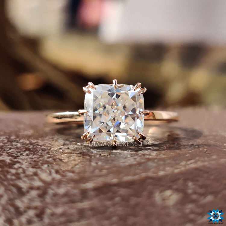 Handmade solitaire ring with compass prong setting.