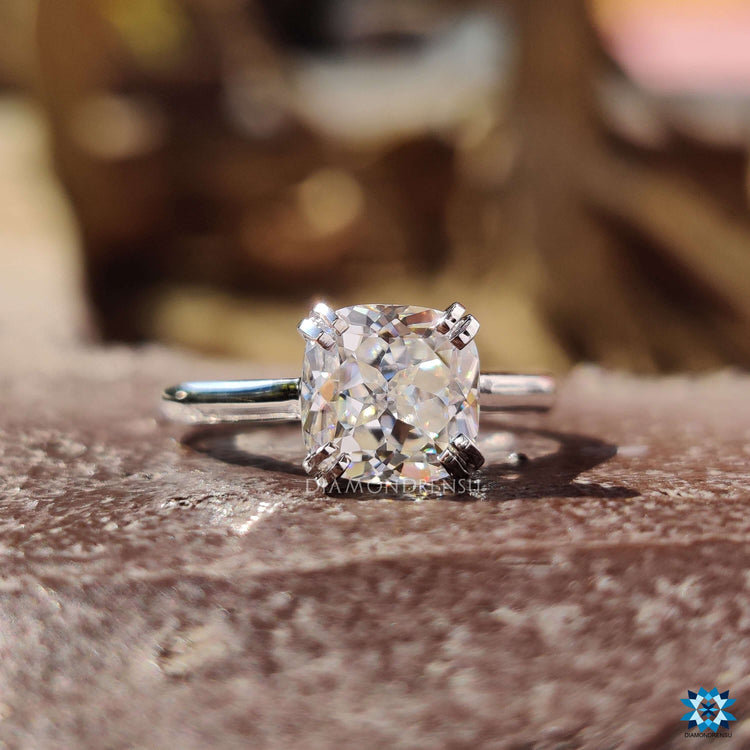Cushion Rensu cut moissanite ring designed as a solitaire.