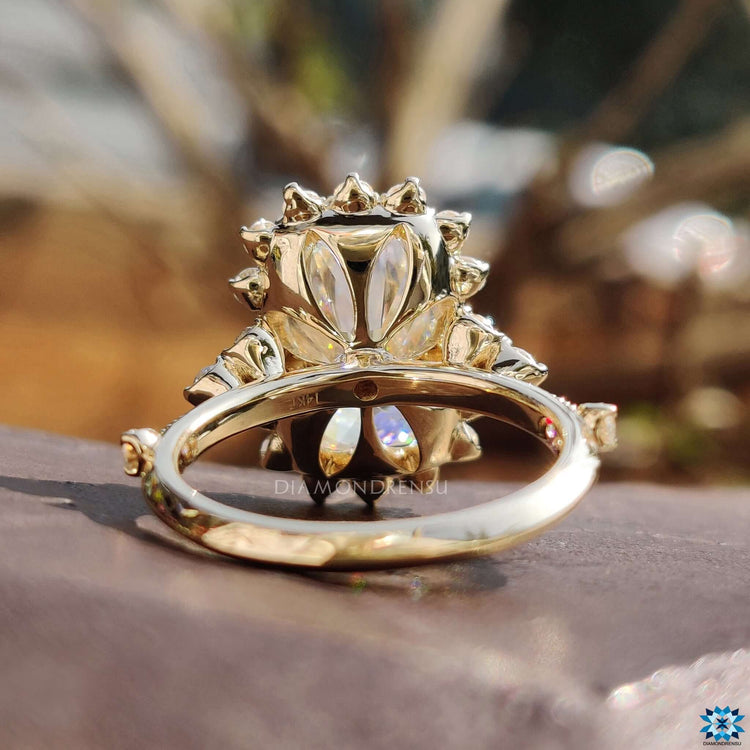 Vintage-style cushion cut ring with round accents.