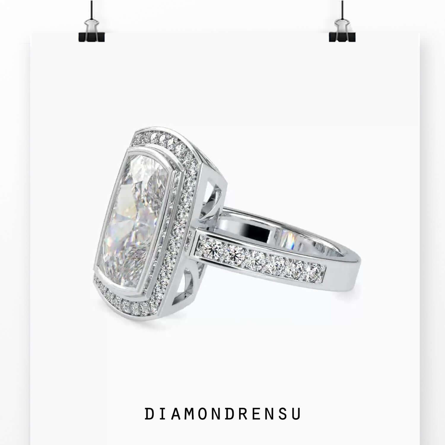 Designer ring with bezel set cushion cut diamond.