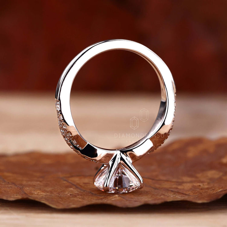 Pave twisted engagement ring with an IGI certified diamond.