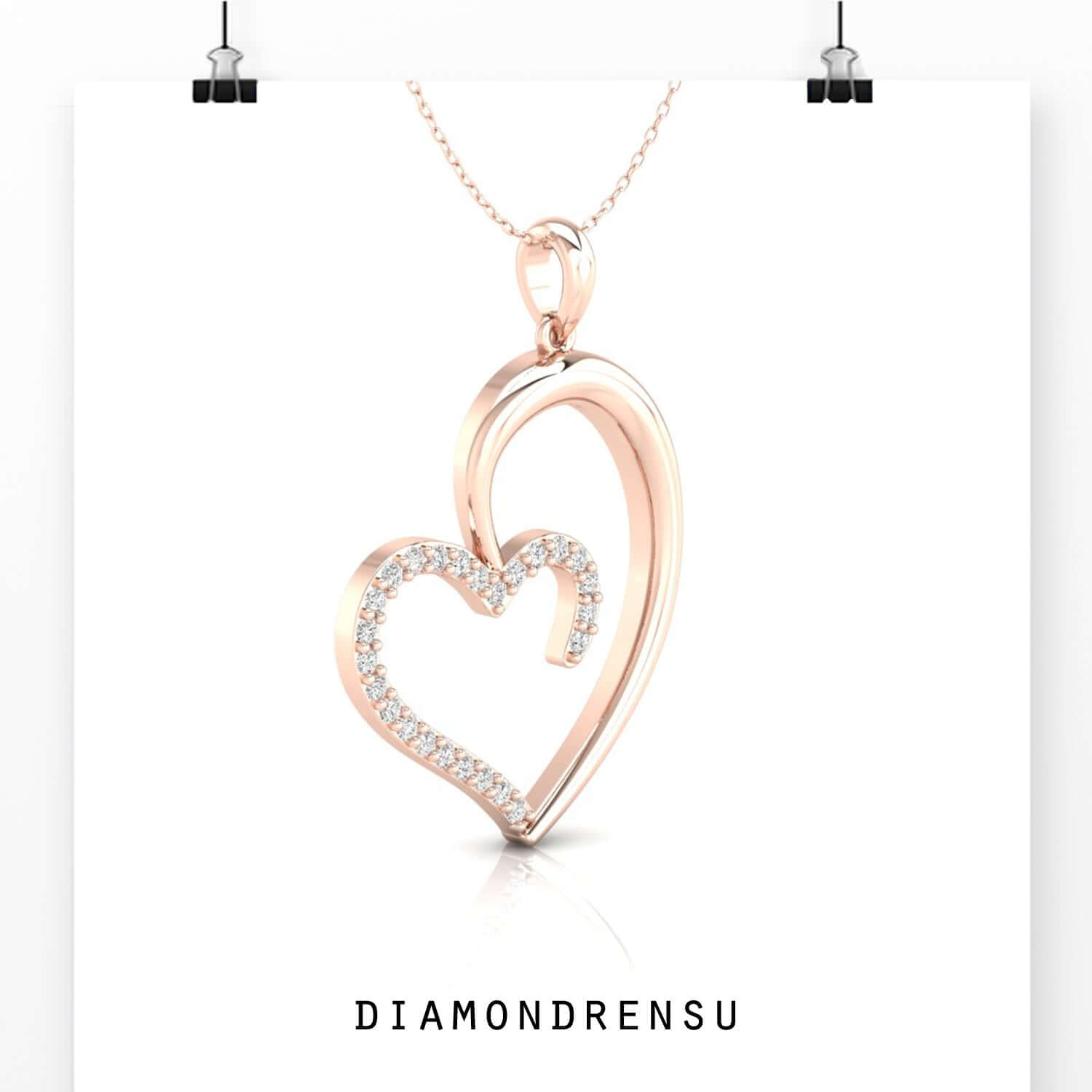 Designer heart pendant in white, yellow, and rose gold.