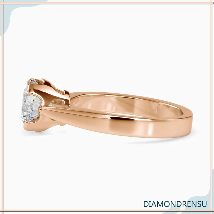 Diamondrensu UK ring with 4 prong solitaire and custom style.