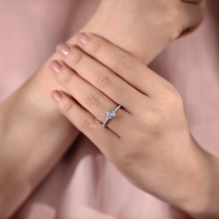White gold handmade ring featuring pave accents.