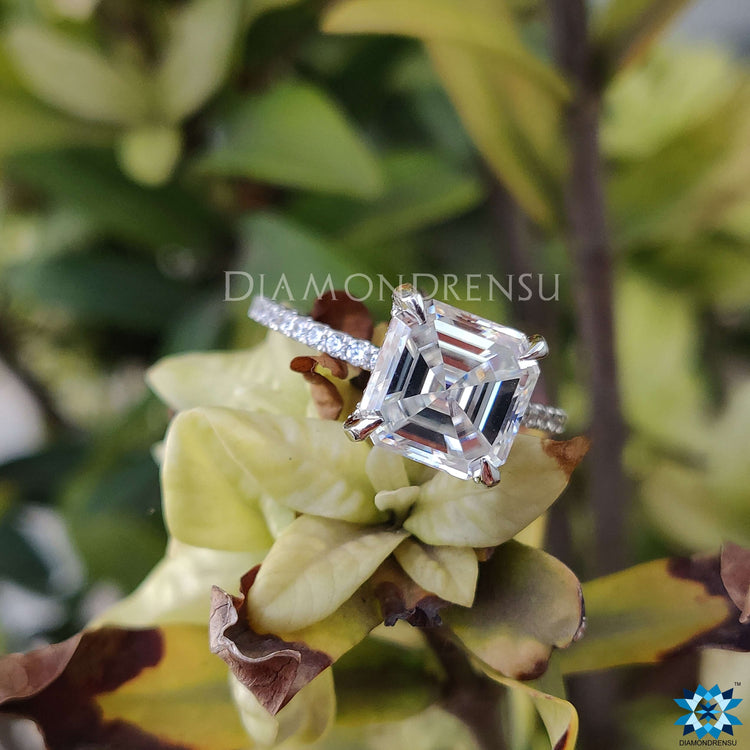 Hidden halo Moissanite ring with Asscher cut center and custom white gold band.