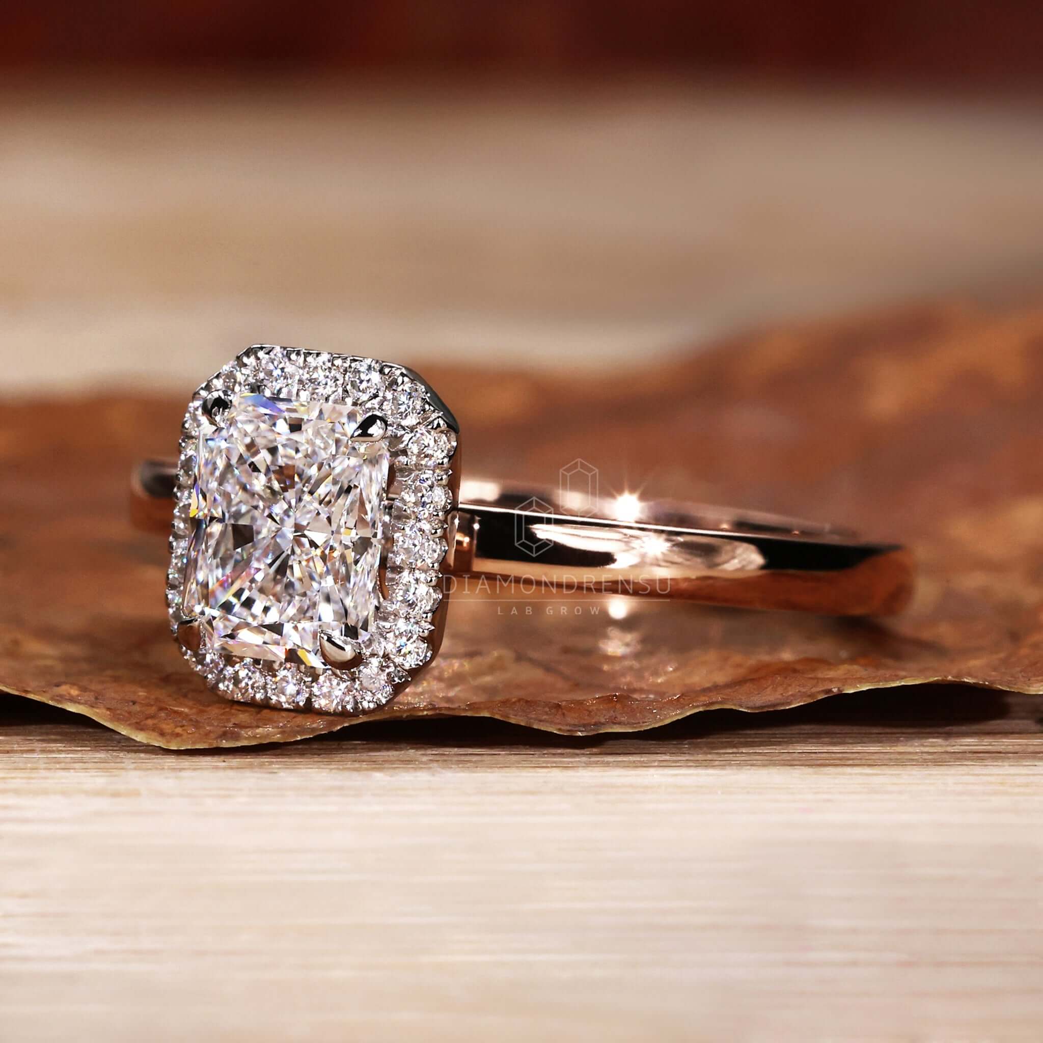 Radiant engagement ring featuring a diamondrensu UK ring design with an elegant halo ring setting.