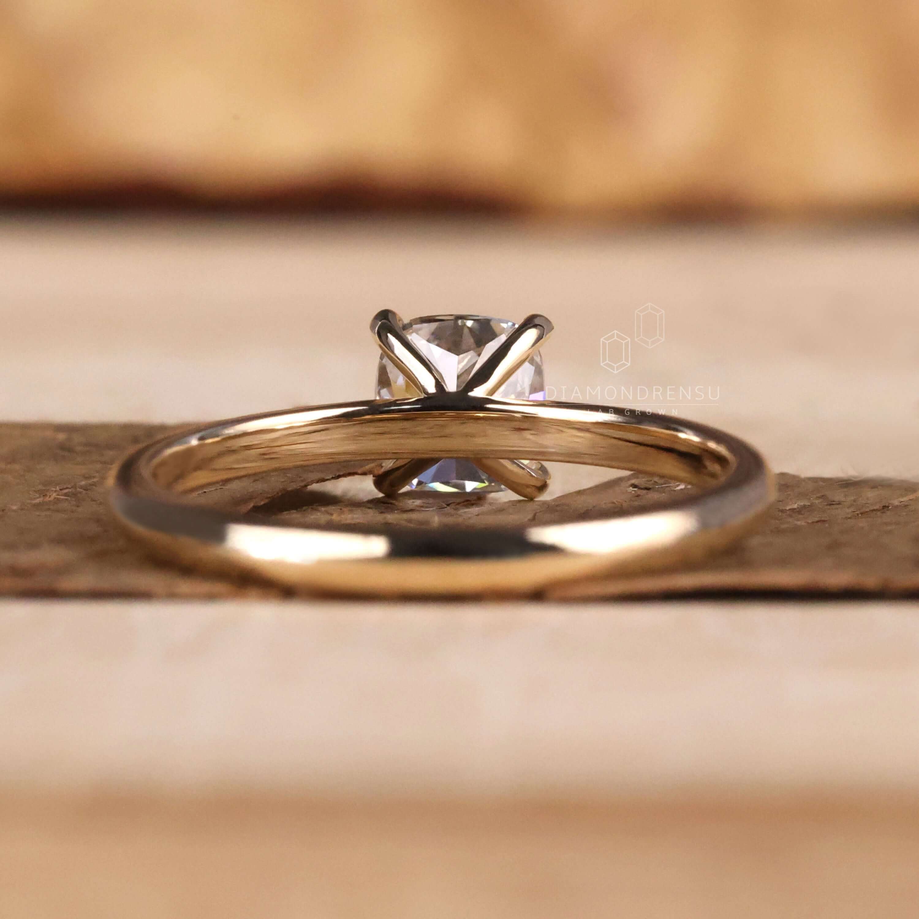 Cushion engagement ring featuring a solitaire diamond in a claw prong setting, designed for everlasting beauty and charm.