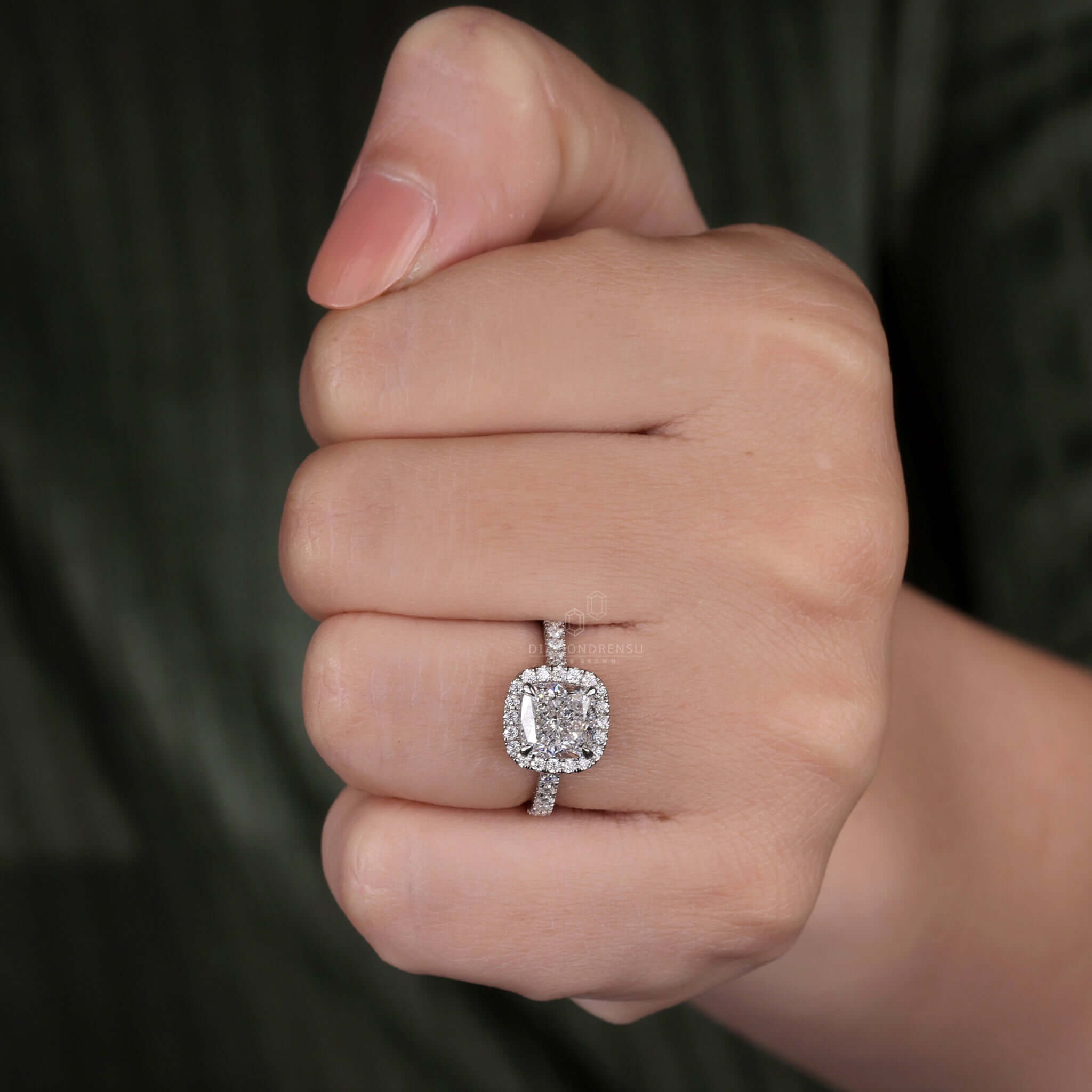 Cushion ring featuring a halo diamond ring for added brilliance.