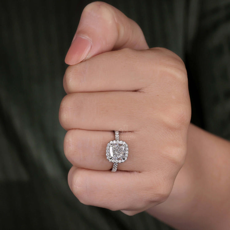 Cushion ring featuring a halo diamond ring for added brilliance.