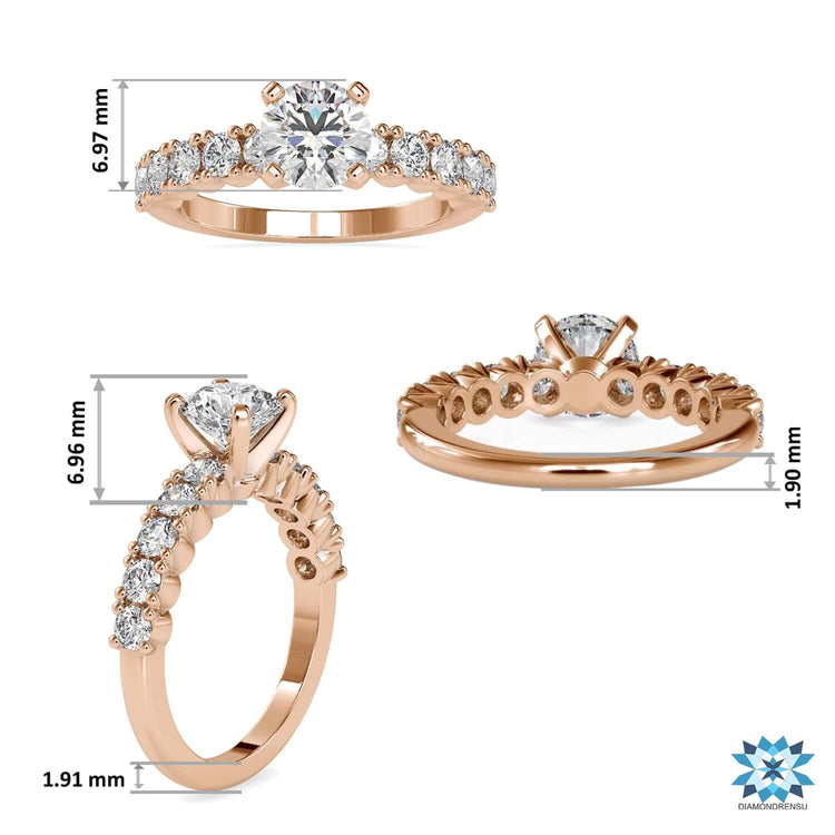 Yellow gold ring with round cut pave band and centre diamond.