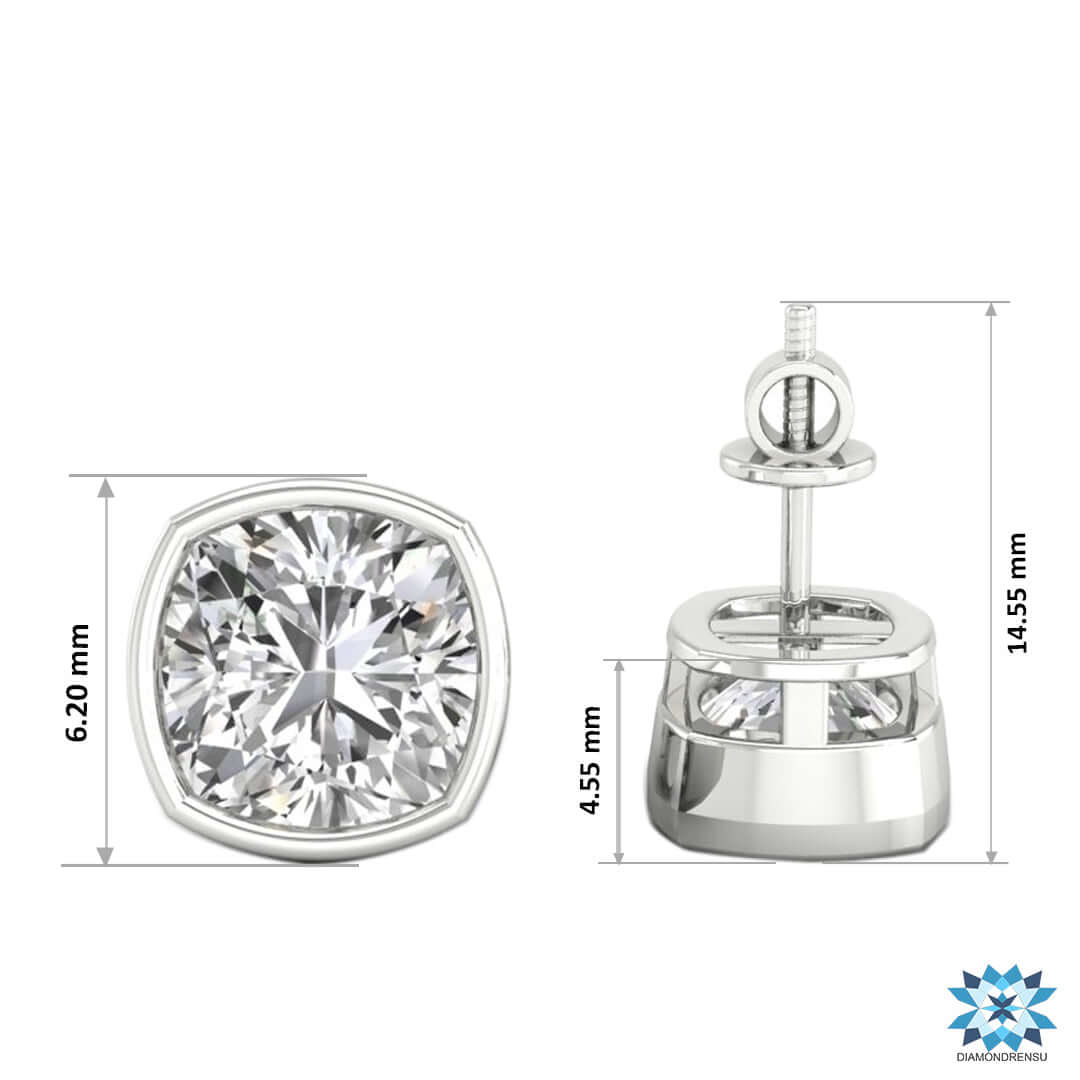 Lab grown cushion cut diamond bezel set earrings in gold.
