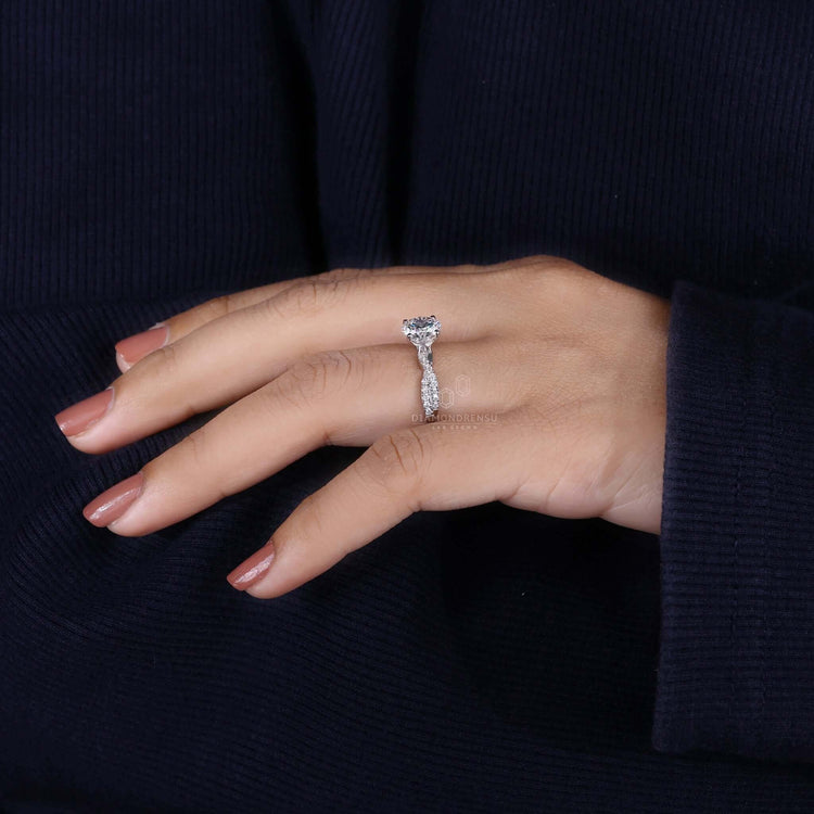 Exquisite round diamond engagement ring with a prong setting.