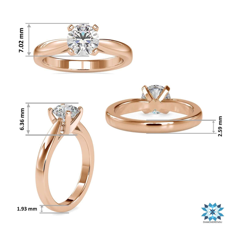 Yellow gold diamond ring featuring tapered shank design.