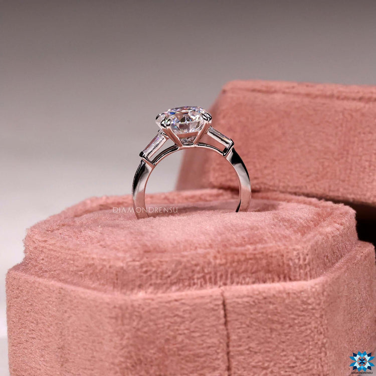 Double claw prong ring with round moissanite center.