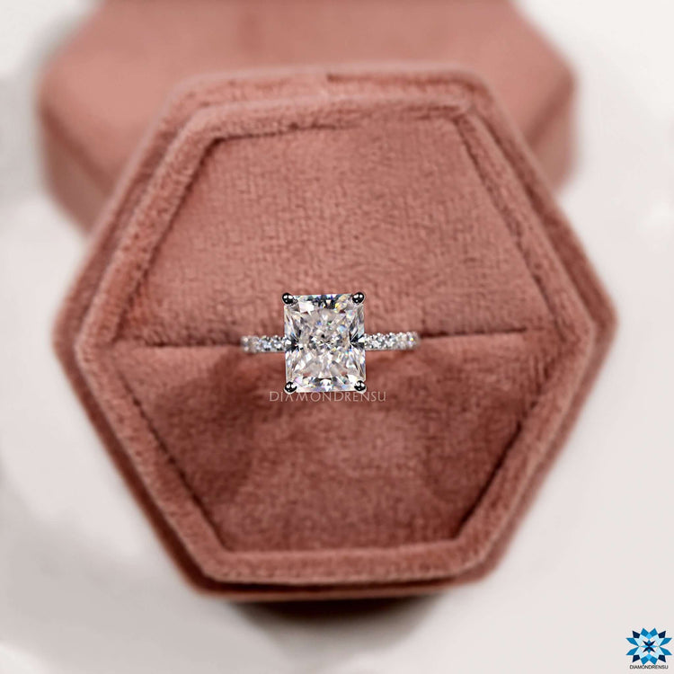 Four prong radiant cut moissanite ring in white gold.