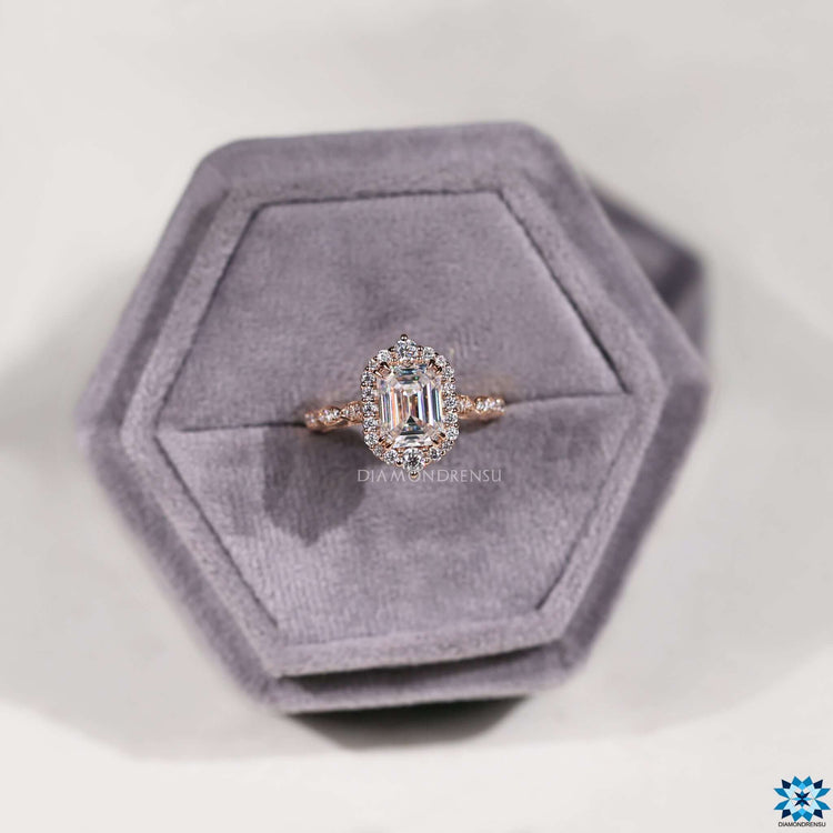 Blue moissanite ring with milgrain detailing.