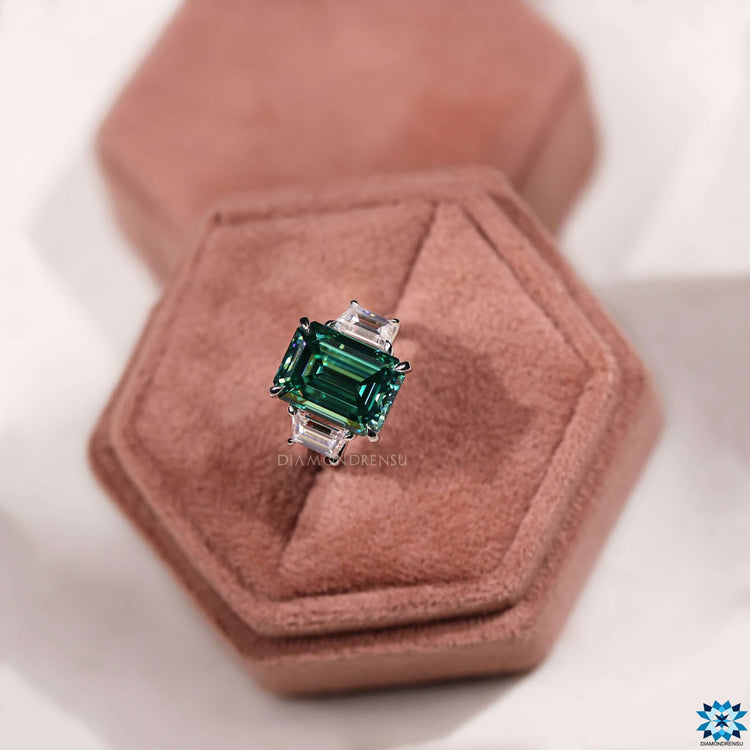 White and yellow gold ring with green center stone.