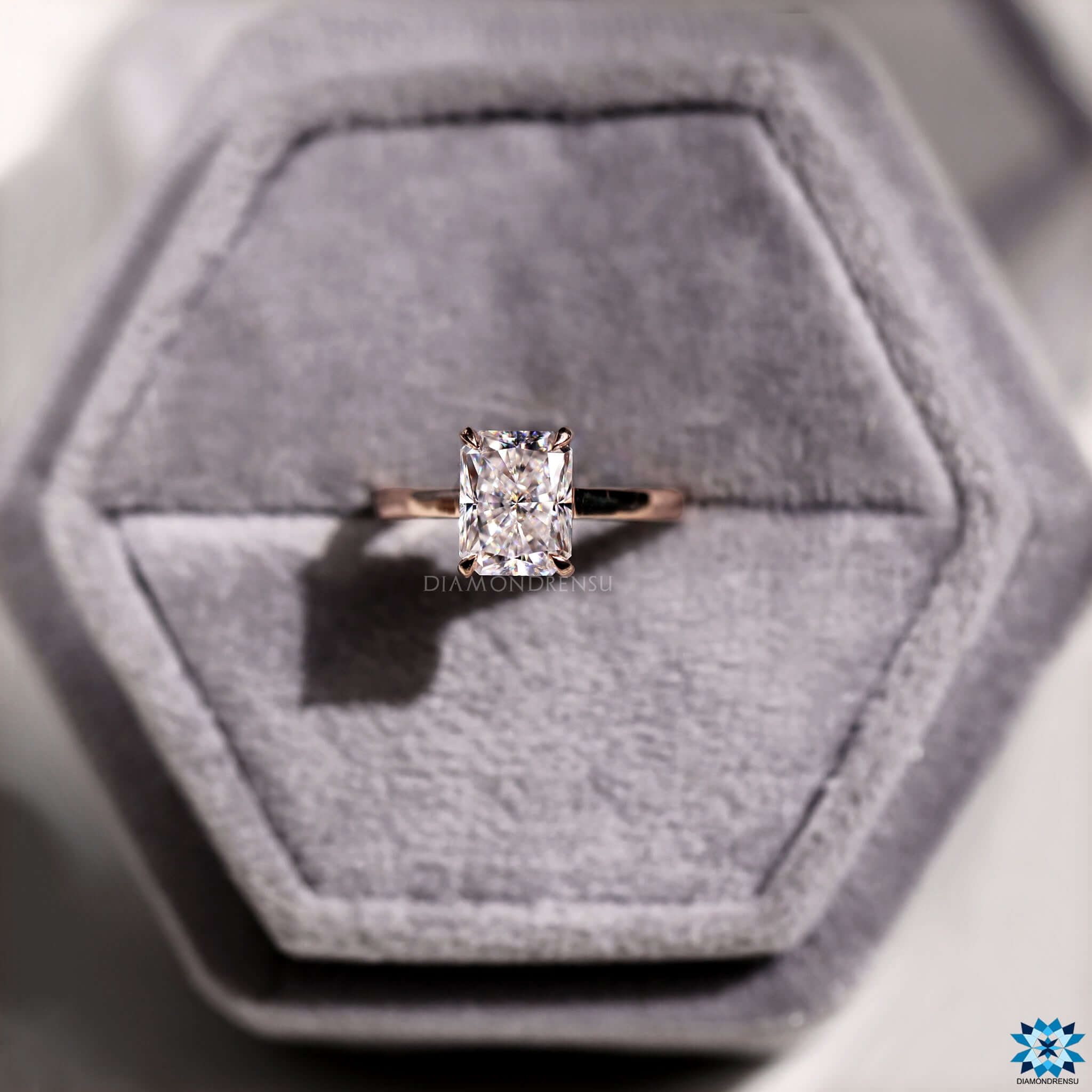 Handmade moissanite engagement ring in rose gold.