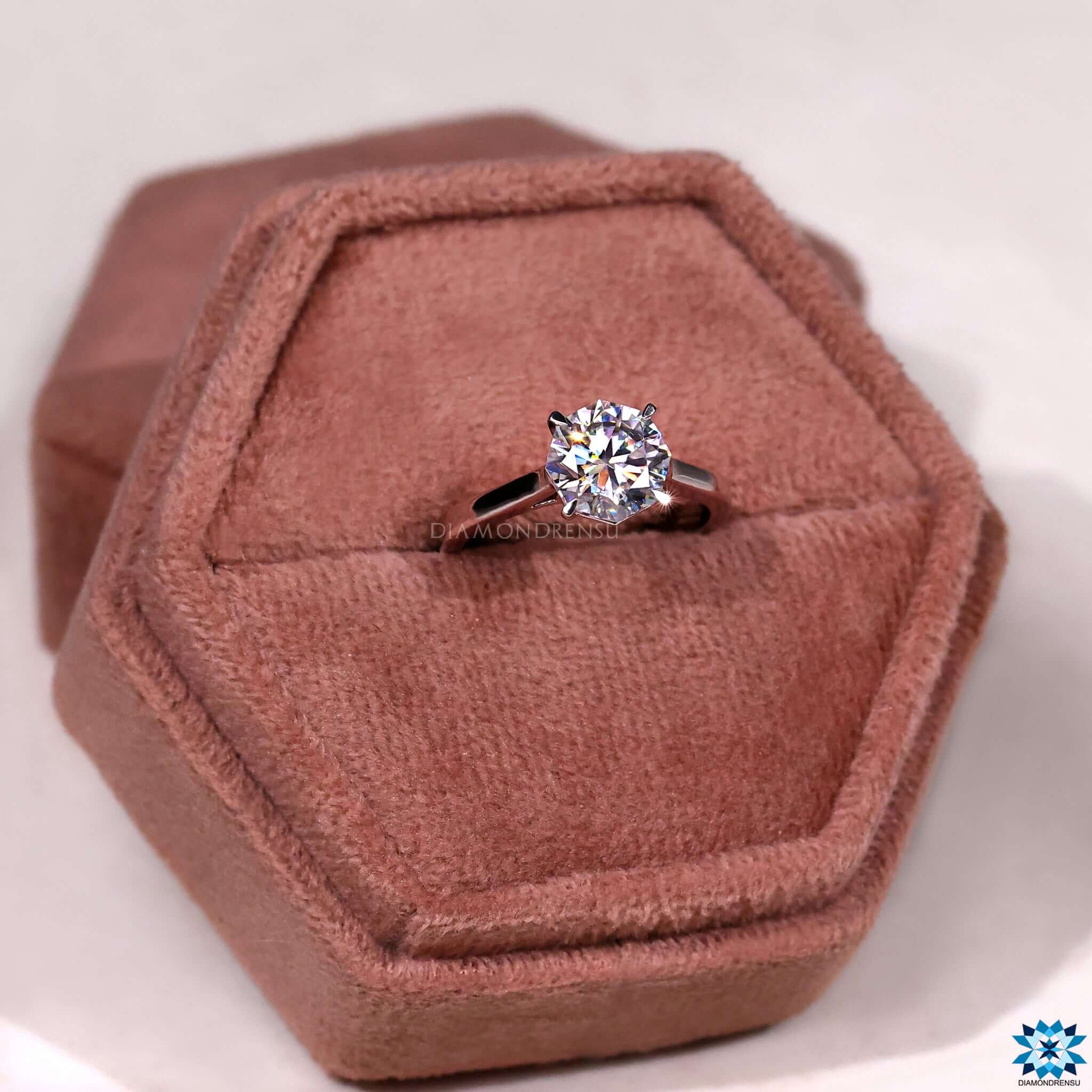 Gold moissanite ring with hidden infinity detail.