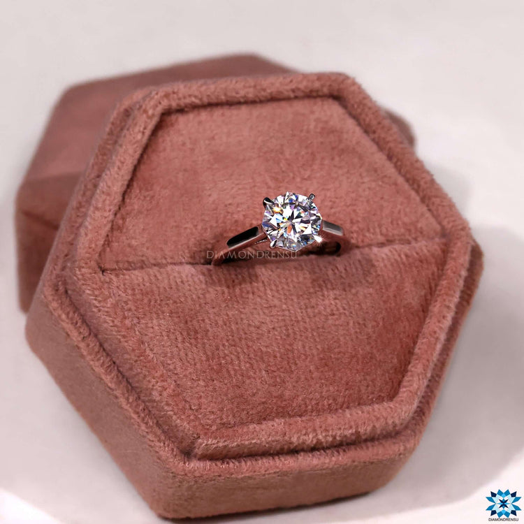 Gold moissanite ring with hidden infinity detail.