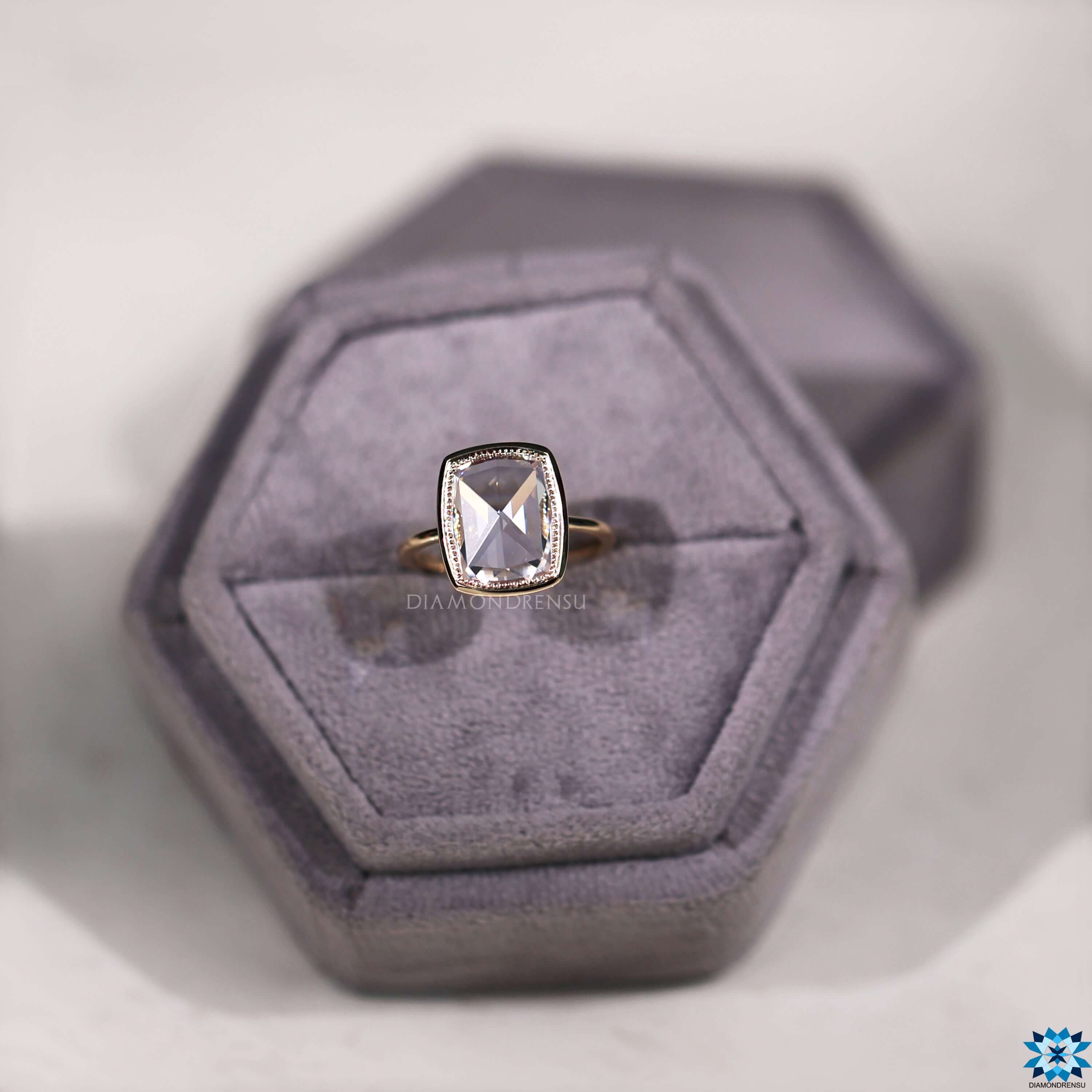 Solitaire engagement ring with rose cut moissanite.