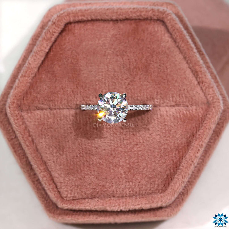 Claw prong setting on white gold moissanite ring.
