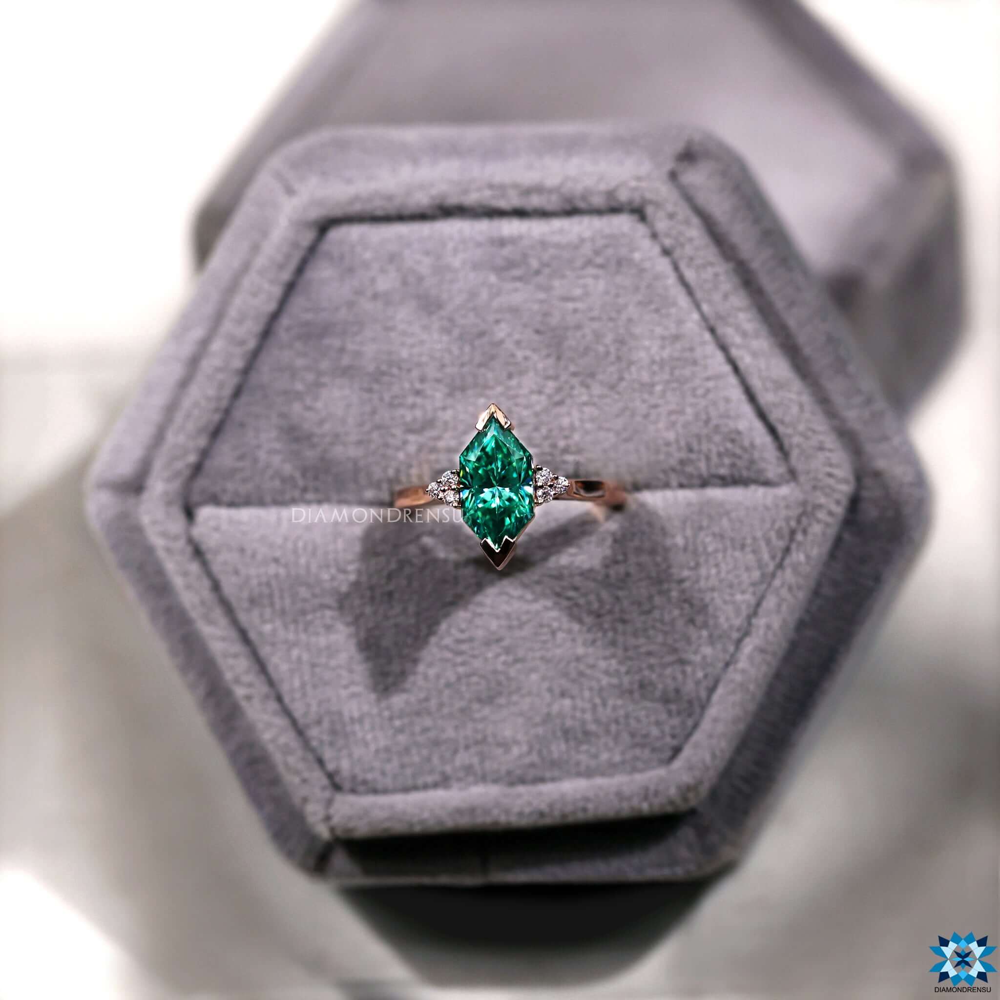 Infinity shank ring in yellow gold with Dutch marquise cut moissanite.