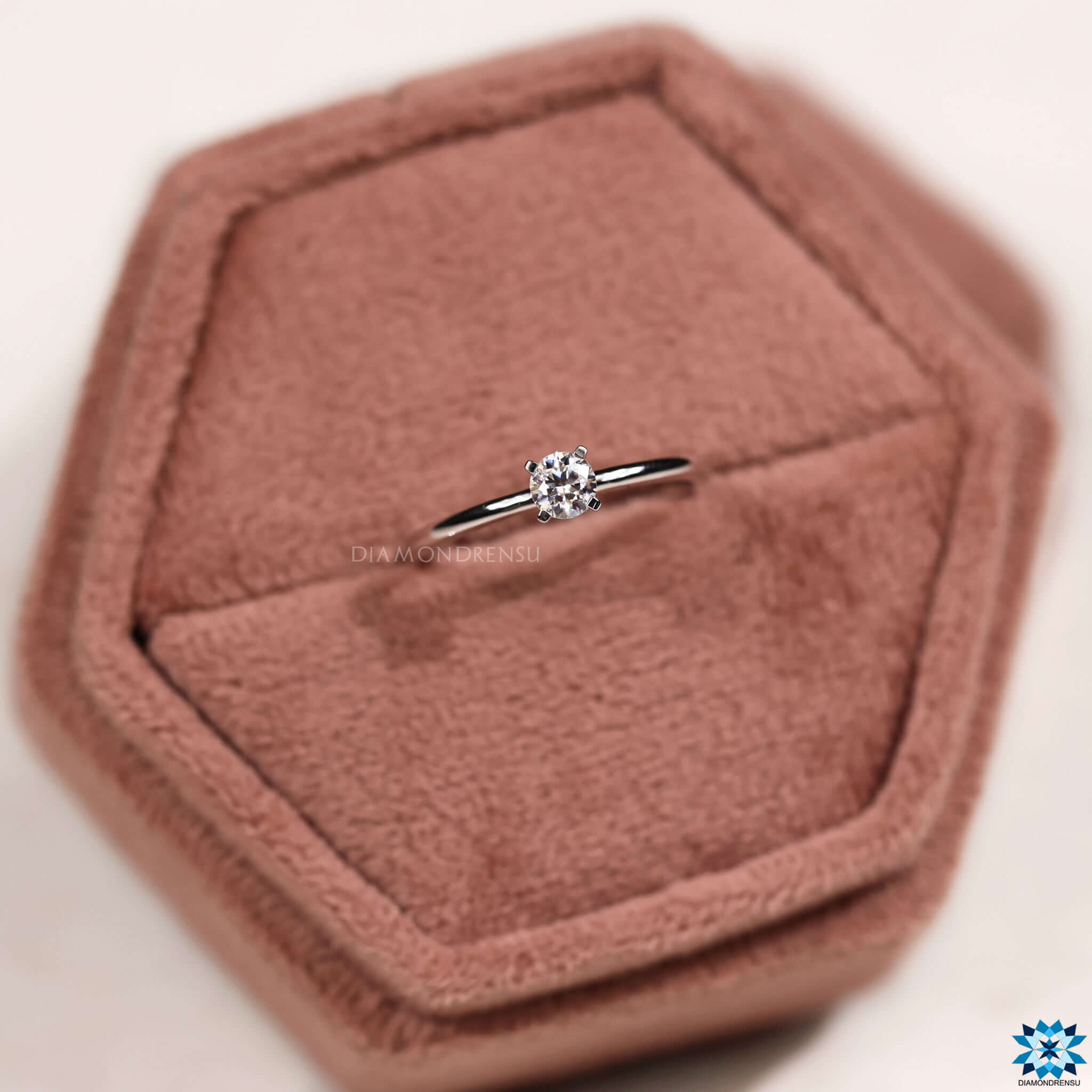 Custom moissanite engagement ring with prong setting.