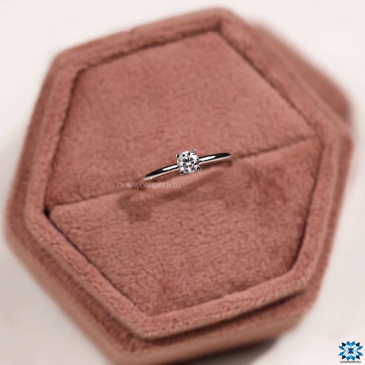 Custom moissanite engagement ring with prong setting.