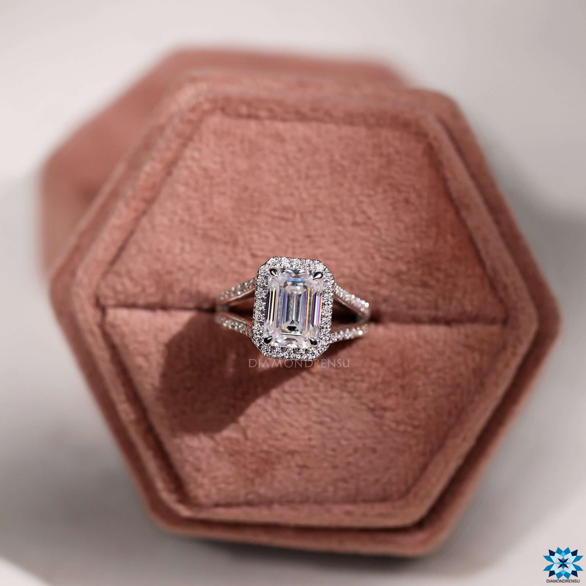 Halo moissanite ring with pave split shank.